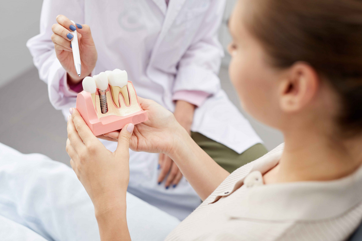 Laser tooth drilling with nerve treatment