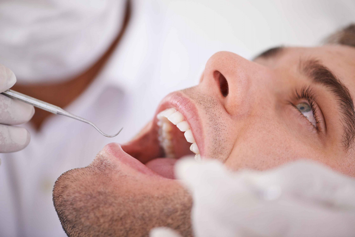 Surgical cutting of the gums of the jaws